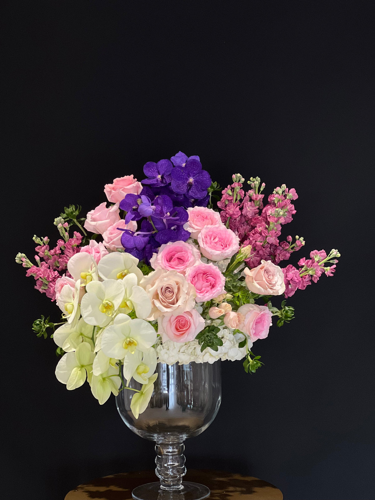 "Elegant Mother's Day Flowers from Yonge Florist - Flowers for Mom" Vase arrangement of orchids, roses and stocks.