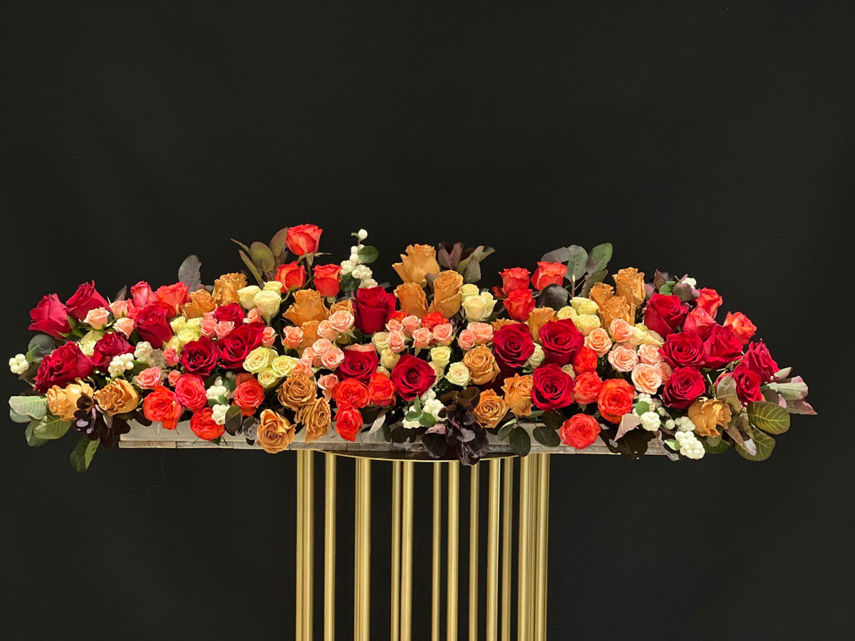 Autumn Splendor Centerpiece, flower arrangement of fall color roses, spray roses.